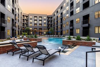 Aura main street apartments in lewisville, texas pool with lounge chairs